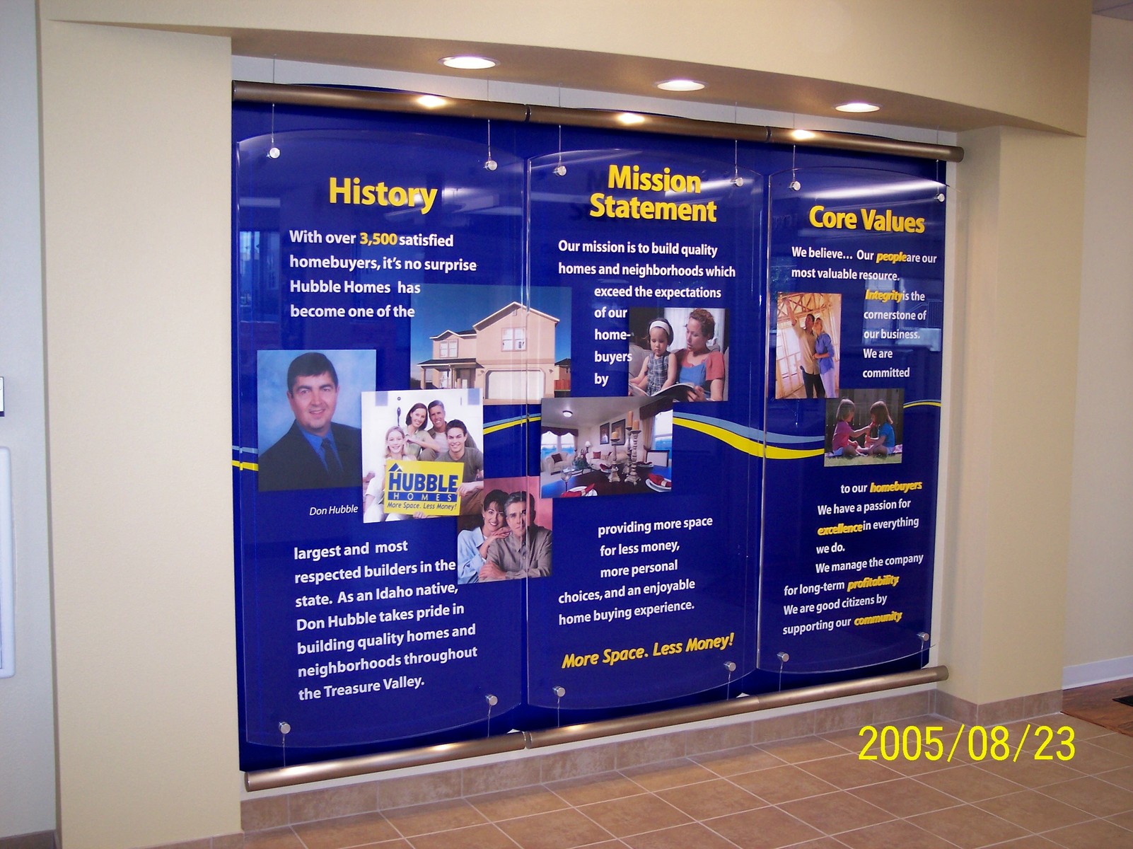 This display has text (some 3D and some in vinyl) mounted to 1/2 inch thick lexan acrylic. Behind it are graphics stood off to make a floating effect over the blue background made from dibond.